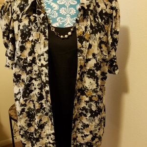 1x tan and black career blouse.